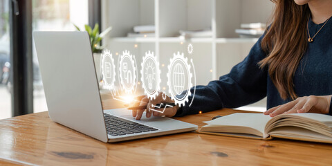 Young woman on laptop at library. Concept of working process, internet surfing, online education. Student send email. Close up view. Formula math icons