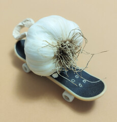 happy funny garlic on the skateboard with white wheels