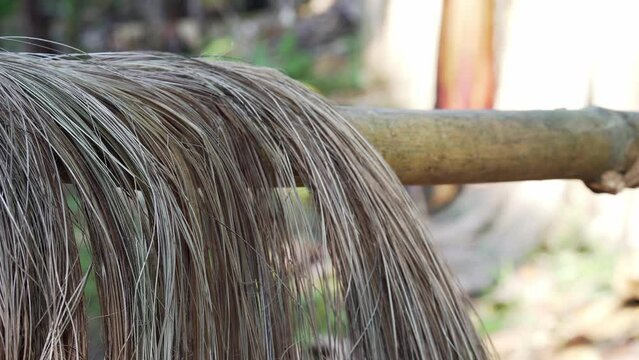 Philippine commodity Abaca fibers drying on bamboo pole on a sunny day in the Island of Catanduanes, Bicol Region.