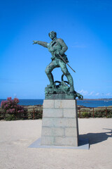 Statue of Surcouf located on the promenade of the ramparts in Saint-Malo in France - obrazy, fototapety, plakaty