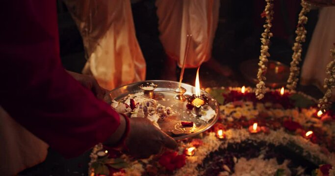 Hindu Religious Ceremony Traditions: Slow Motion of Group of People Burning Sages and Giving Offerings to an Altar During Shiva Aarti Ritual in a Temple. Devoted Indian Worshipers Praying