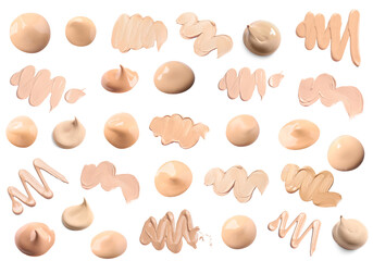 Foundations of various shades and textures for different skin tones and types isolated on white. Set of samples