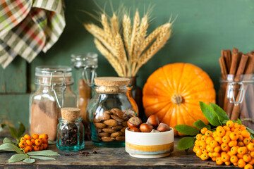 Spices for making homemade autumn pastries on a dark background, rustic.