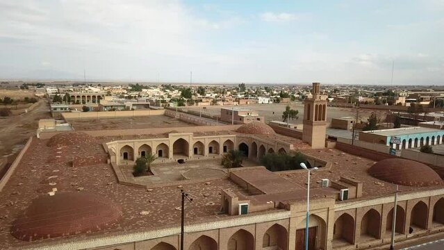 Sunset in caravansary in desert climate city with mud brick adobe houses in yazd aqda use for rest stop for post men in ancient historical time down town old city of ardakan