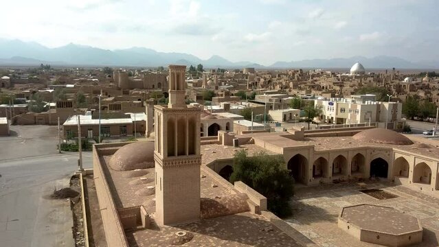 Fly over caravanserai chapar khaneh ancient post office building i desert hot climate in Yazd Aqda in Iran to stop post transportation have rest and distribute package in middle east Asia delivery