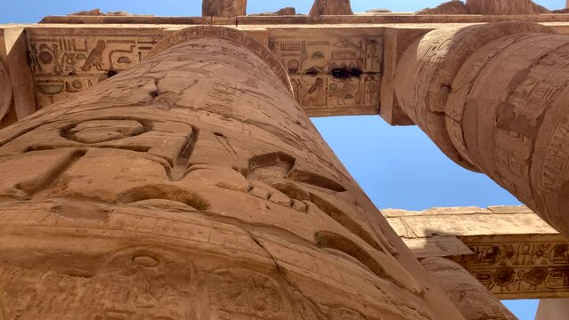 Karnac temple column tops, Egypt. Circular pan upwards showing the remains of the painted temple ceilings.  Sunny day.