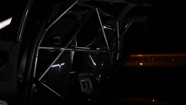 Safety cage detail shot in a professional racing car at night