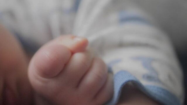 Closeup shot of baby boy hands