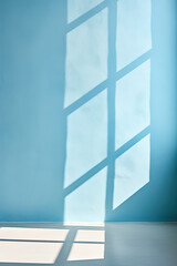 Light blue background with windows casting shadows on a plaster wall ideal for product presentations 