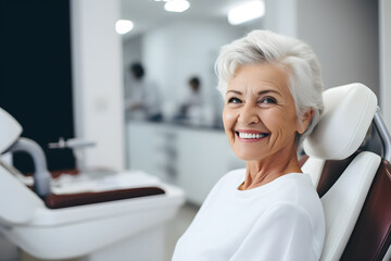 Fototapeta premium a photo of a handsome adult woman client patient at a dental clinic. cleaning and repairing teeth at a dentist doctor. laying on the orthodontic dental chair