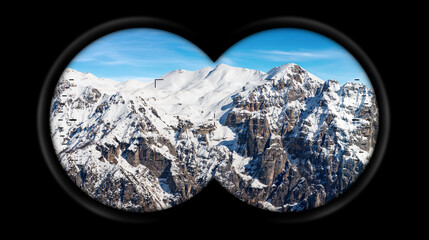 Binoculars point of view with snow capped peaks of Italian Alps. Mountain range of Monte Carega in...