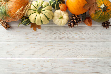 Captivating top view of autumn harvest treasures. Ripe pumpkins, maple leaves and fall attributes...