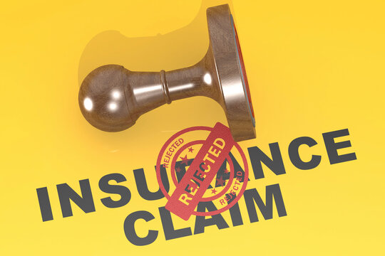 Rejected insurance claim concept with wooden stamp