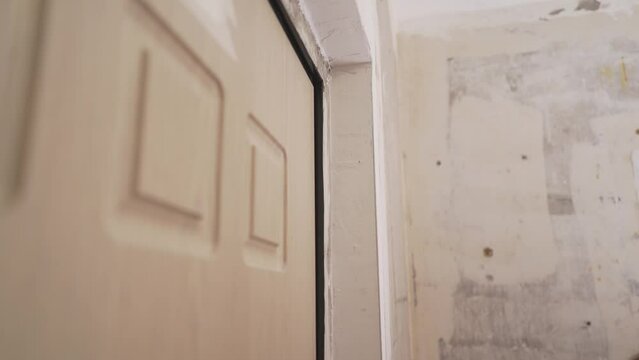 Sanding block for the wall. Sanding the wall after removing the coating. Preparation before painting. Home renovation concept. Sanding the wall before applying putty.