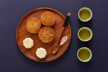 Background of Chinese Traditional Festival Mid-Autumn Festival.The Chinese meaning on the mooncake in the picture is: high-quality five kernels, milk flavored grapes, chestnuts, three flavors.