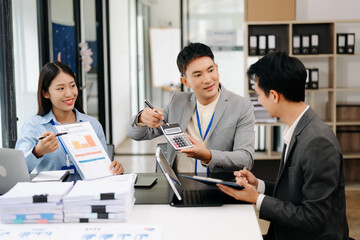 Business team discuss at meeting room. working together with laptop ,tablet and smart phone on desk Financial accountant , planner , meeting , introduction concept. At office