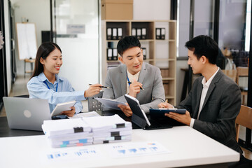 Business team discuss at meeting room. working together with laptop ,tablet and smart phone on desk Financial accountant , planner , meeting , introduction concept. At office