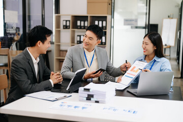Business team discuss at meeting room. working together with laptop ,tablet and smart phone on desk Financial accountant , planner , meeting , introduction concept. At office