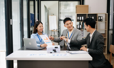 Business team discuss at meeting room. working together with laptop ,tablet and smart phone on desk Financial accountant , planner , meeting , introduction concept. At office