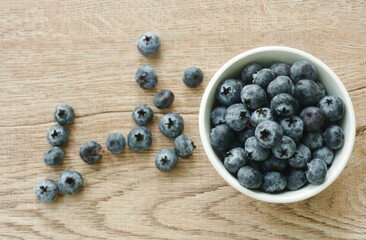 fresh blueberry purple fruit arranging in cup on table