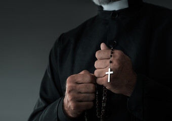 Close up of a priest holding rosary with copy space - 641315241