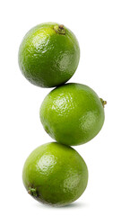 Limes stand on top of each other close-up on a white background. Isolated