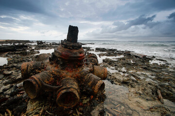 Vanuatu, Sanma Province, Espiritu Santo Island, Luganville, Million Dollar Point, mechanical remnants of military equipment from World War Two, wreckage of an airplane engine at the seaside