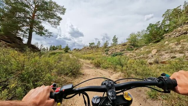 POV Electric Bike Riding Up and then Down on a Mountain Hill with Sticking Stones. 60 fps, H.264, 8bit, chroma subsamlping 4:4:4