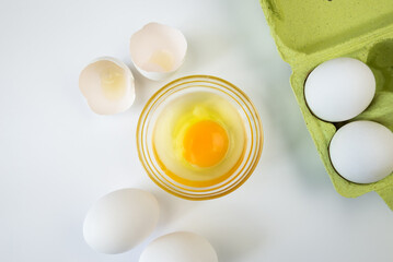 raw eggs on a white background. Egg in a bowl.