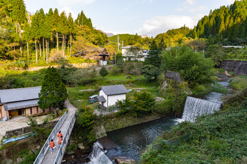 Kurokawa Onsen, Kumamoto, Japan, one of Japan's most attractive hot spring towns, with ryokan, bath houses, tourist shops and cafes - obrazy, fototapety, plakaty