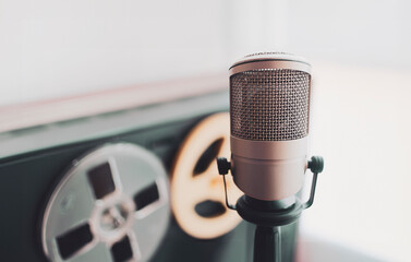 Professional microphone and tape recorder in sound studio