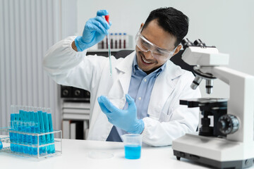 Science and medicine, scientist analyzing and dropping a sample into a glassware, experiments containing chemical liquid in laboratory on glassware, innovative and technology.