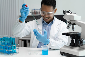 Science and medicine, scientist analyzing and dropping a sample into a glassware, experiments...