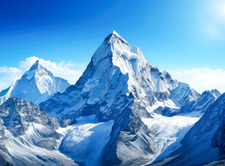 Mount Everest peak, snowcapped mountain with blue sky, snowy ridge covered with snow.