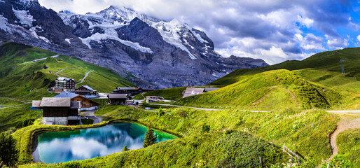 amazing Swiss nature . Kleine Scheidegg mountain pass that runs between the famous Eiger and the...
