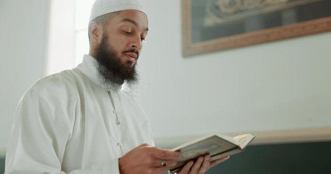 Quran, Muslim and man reading for faith in a mosque for praying, peace and spiritual care in holy religion for Allah. Respect, Ramadan and Islamic person with kindness, hope and humble after worship