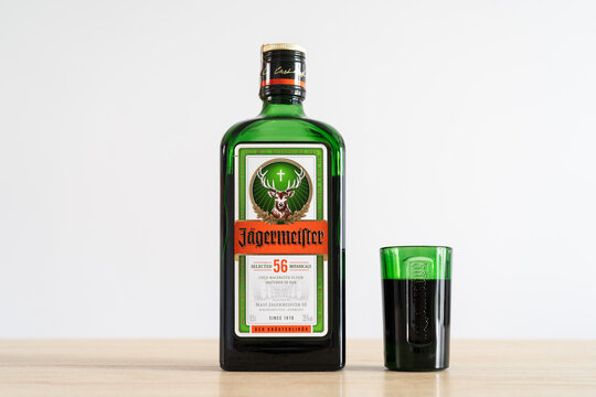 J&auml;germeister bottle and shot glass. German digestive alcohol drink. Jagermeister digestif herbal liqueur made with 56 herbs and spices on August 20, 2023 in Miekinia, Poland.