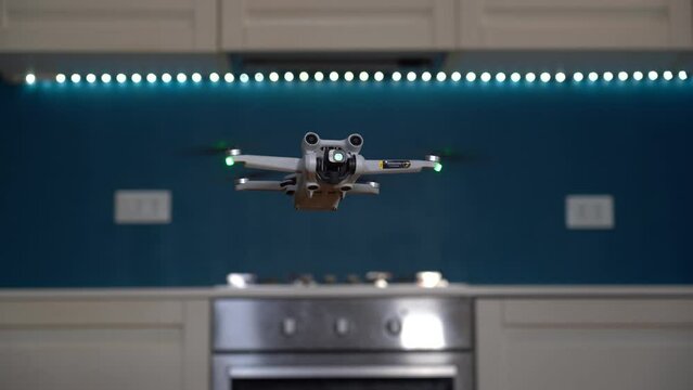 Real estate home shooting with drone - professional photographer use drone to take photos and video of the house to sell - real estate agency takes over the interior of the house 