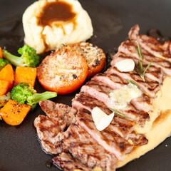 Striploin angus steak with mashed potato and grilled vegetable