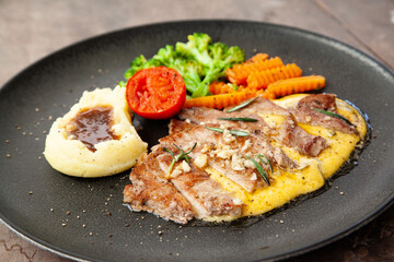 Striploin angus steak with mashed potato and grilled vegetable