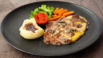 Striploin angus steak with mashed potato and grilled vegetable