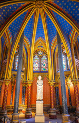 Lower chapel of Sainte-Chapelle with statue of Louis IX. Palais de la Cite, Paris, France