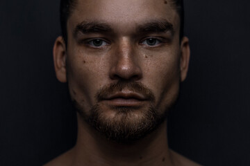 Obraz premium Beautiful male studio portrait with black background