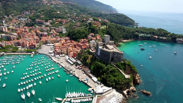Italy, Liguria. famous golf of poets and scenic town Lerici with medieval castle and nice beaches. popular tourist summer destination. aerial drone video
