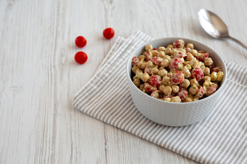 Homemade Pesto Chickpea Snack Salad in a Bowl, side view. Copy space..