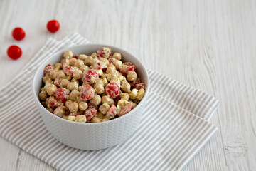 Homemade Pesto Chickpea Snack Salad in a Bowl, side view. Space for text.