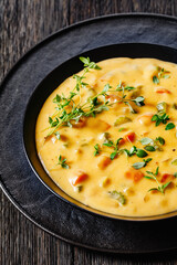 Beer cheese soup with vegetables and thyme