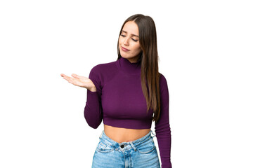 Young beautiful woman over isolated chroma key background holding copyspace with doubts