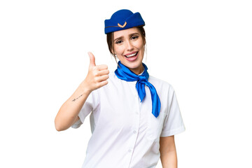 Airplane stewardess over isolated chroma key background with thumbs up because something good has happened
