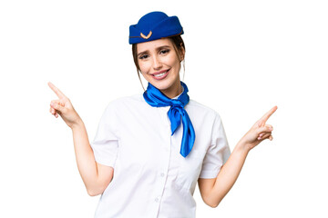 Airplane stewardess over isolated chroma key background pointing finger to the laterals and happy